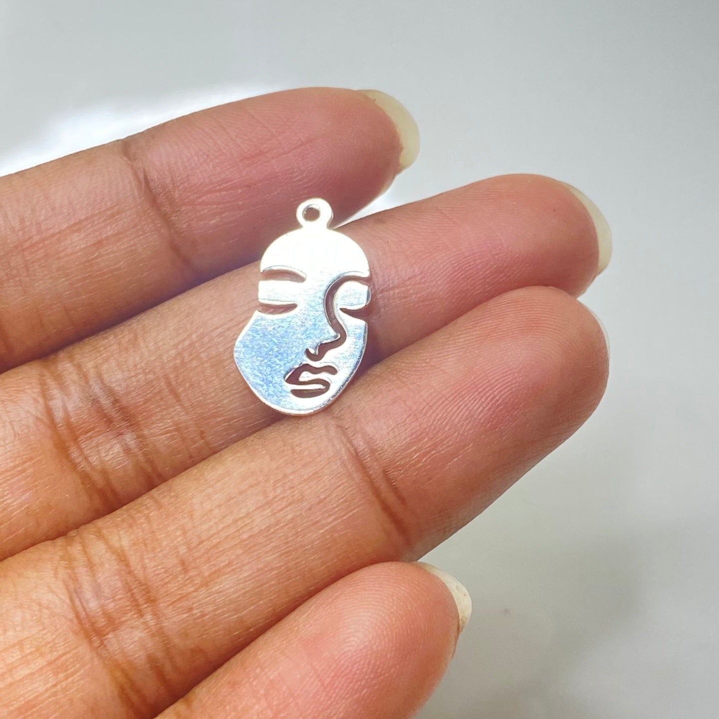 S297 Silver plated face charm