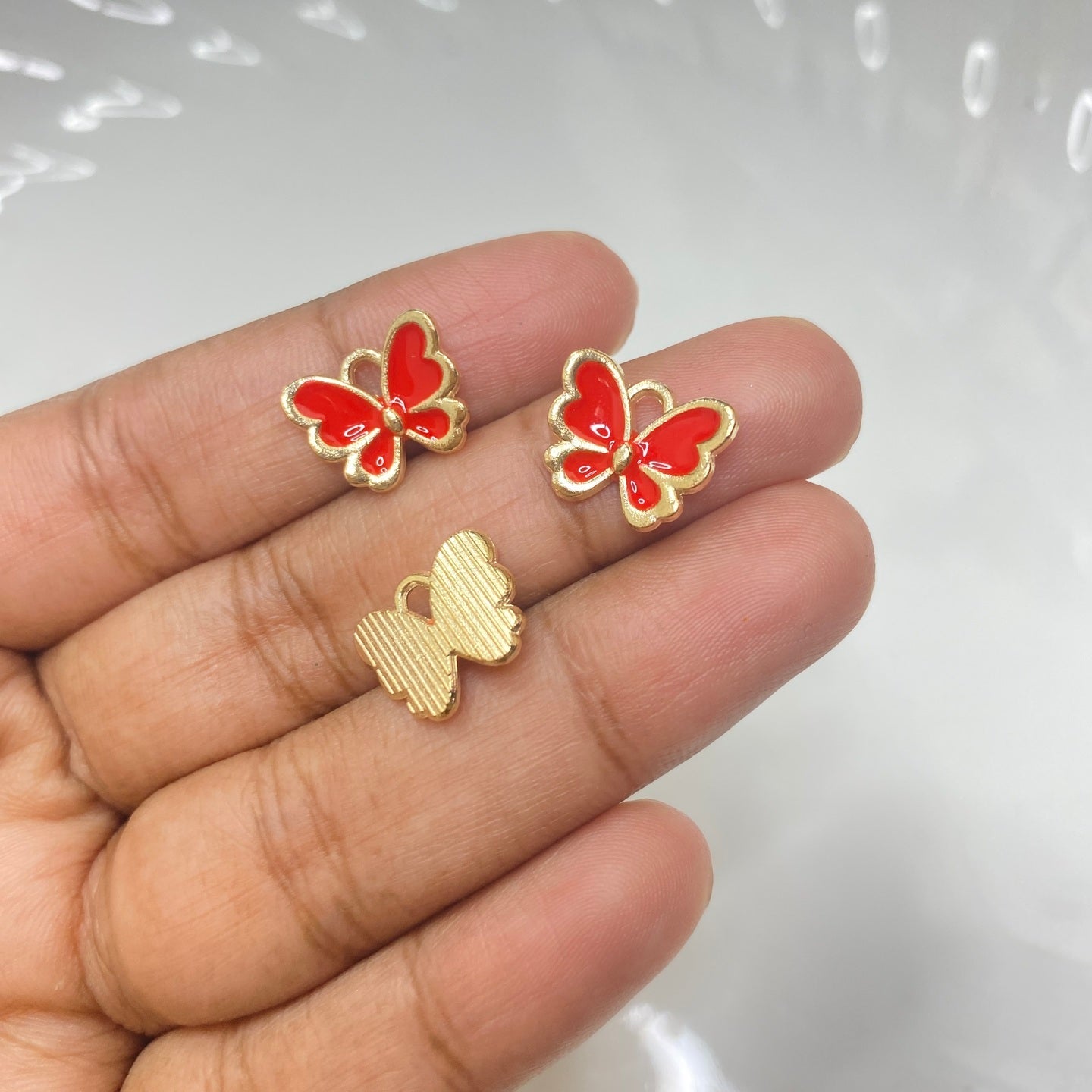 A821 Red butterfly enamel charm