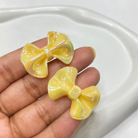 AC 1147 yellow bow iridescent Acrylic bead - per piece