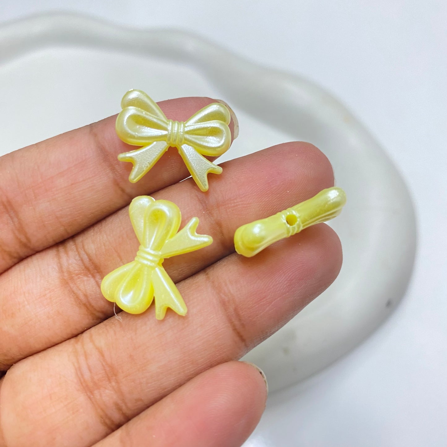 AC 2067 yellow bow pearl shiny luminous Acrylic bead ( 1 pc )