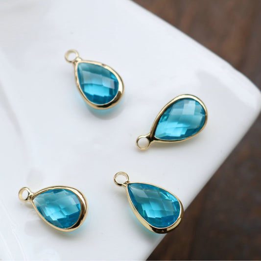 CZ478 Blue teardrop gold plated charm